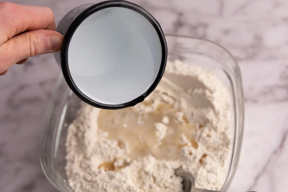 Adding boiling water to pierogi dough