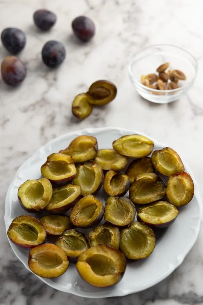Halved and pitted plums