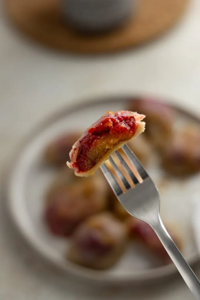 Plum pierogi cut in half