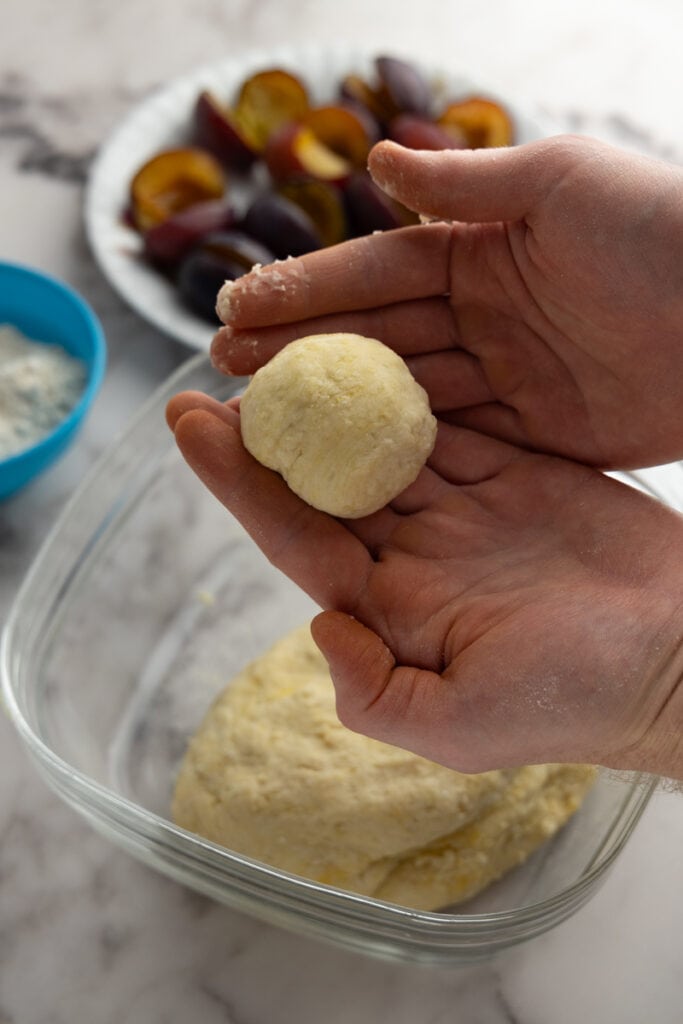 Plum dumplings: dough in hand