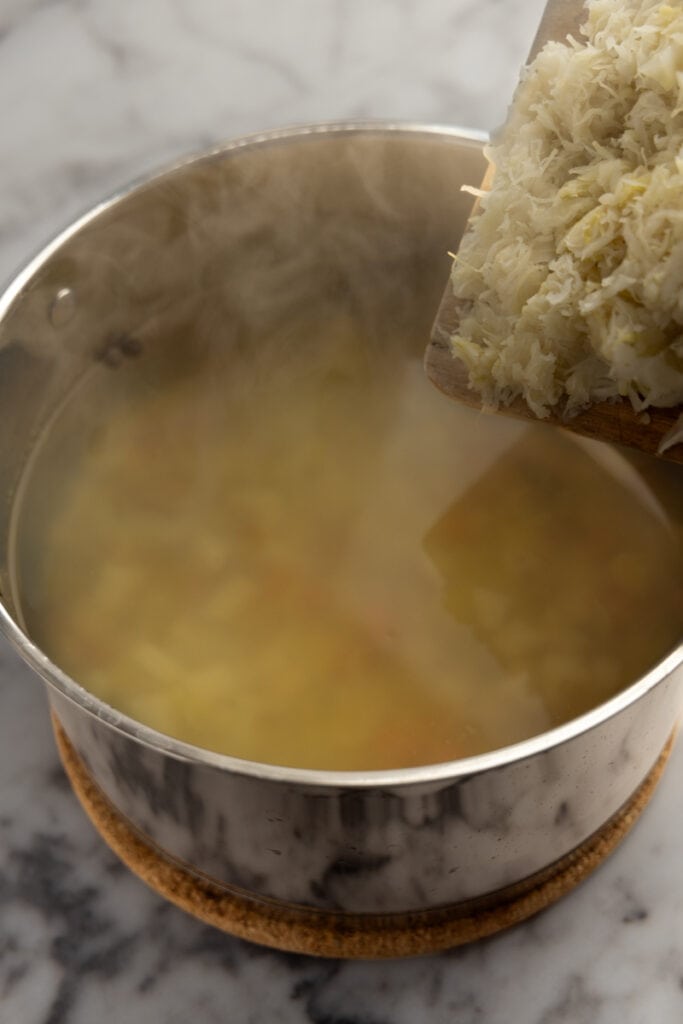 Adding the sauerkraut