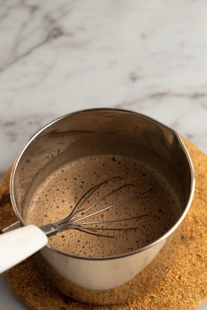 Stirring to melt chocolate