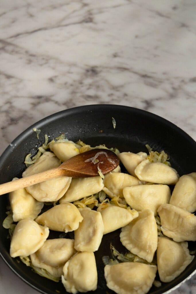 cook pierogi with onions