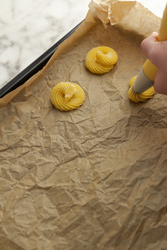Piping the choux pastry dough
