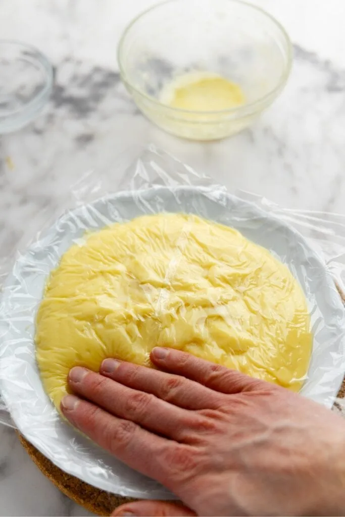 Cover pastry cream with plastic wrap