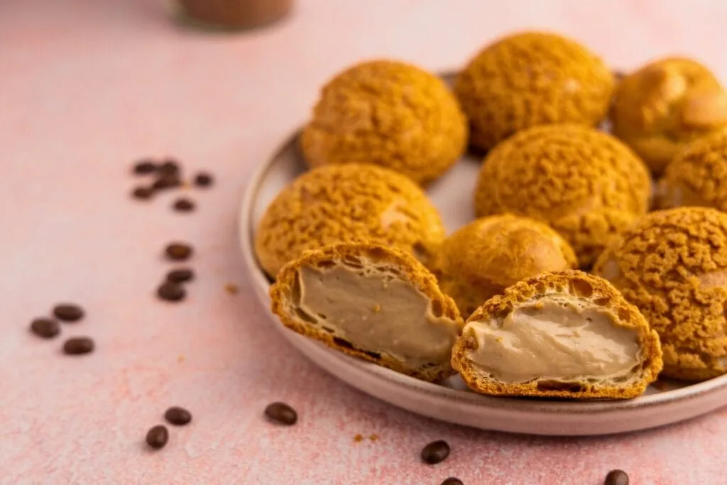 Cream puff with piped coffee pastry filling