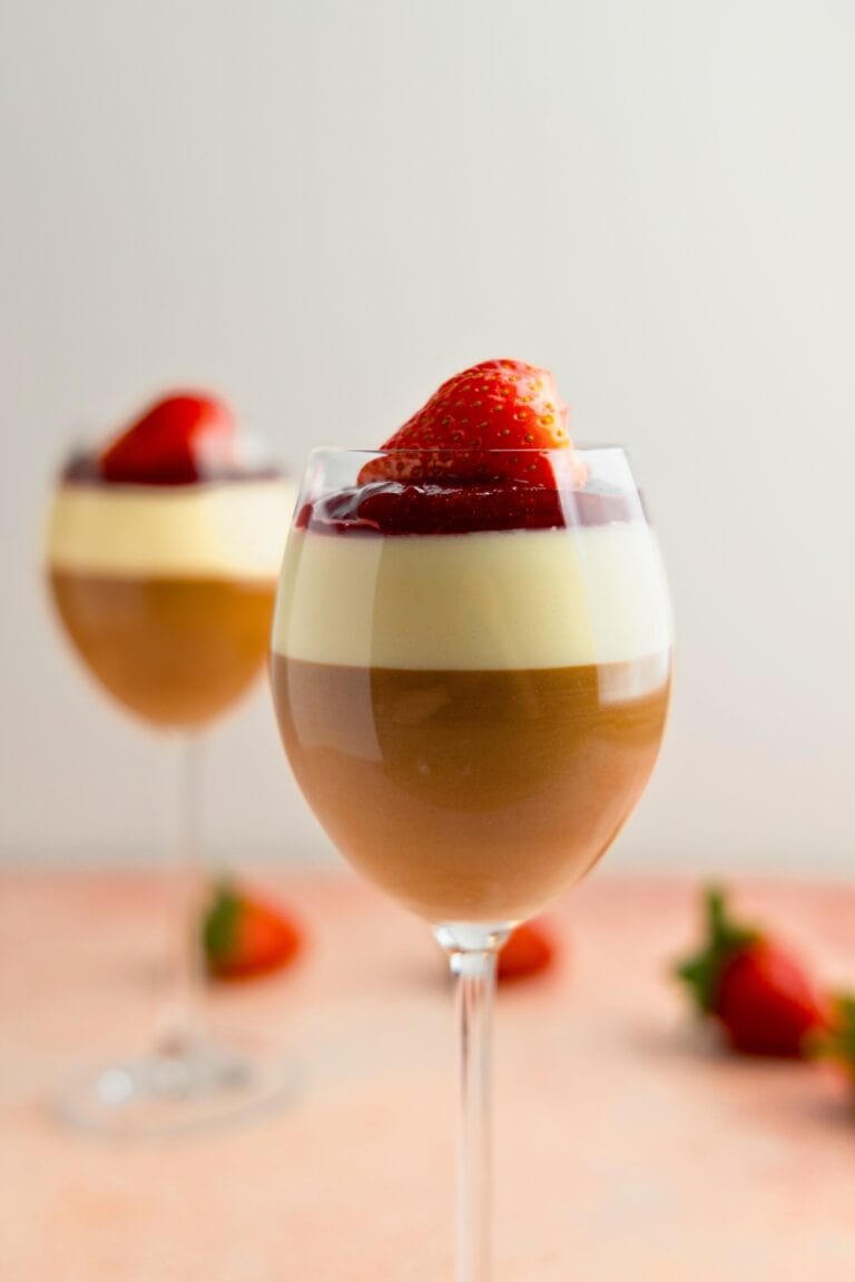 Layered bavarian cream with cherry compote and strawberry