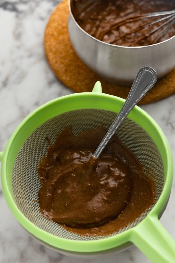 Pour the chocolate mixture into the sieve