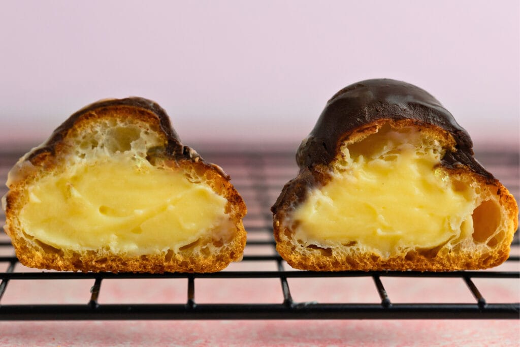 Vanilla pastry cream-filled puffs with ganache topping