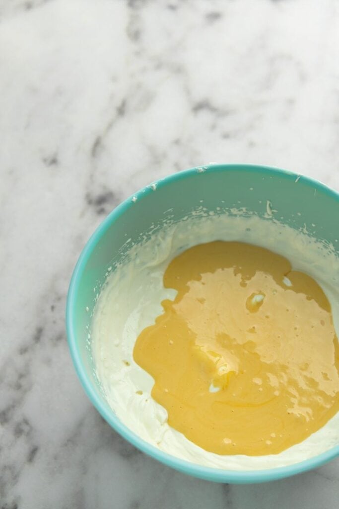 Add yolk mixture to mascarpone and heavy cream