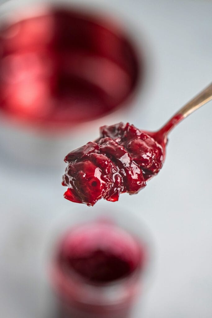 Cherry compote closeup on a teaspoon