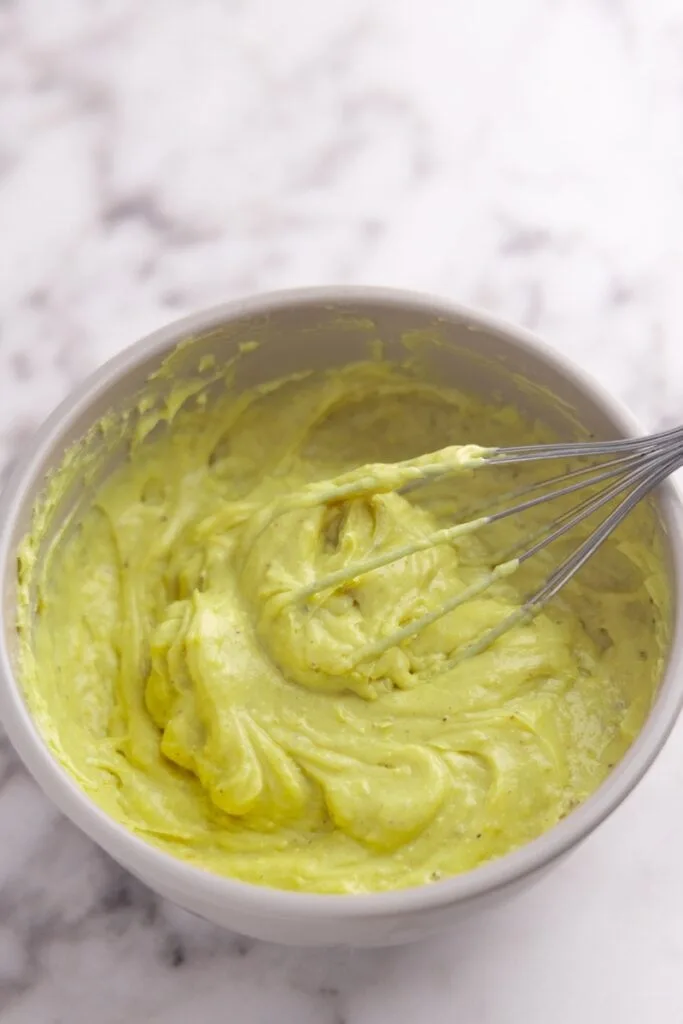 Whisking the chilled pistachio pastry cream