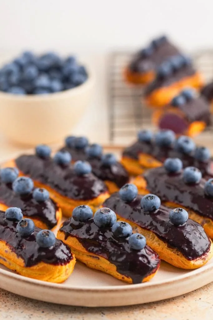 Blueberry eclair dipped in ganache