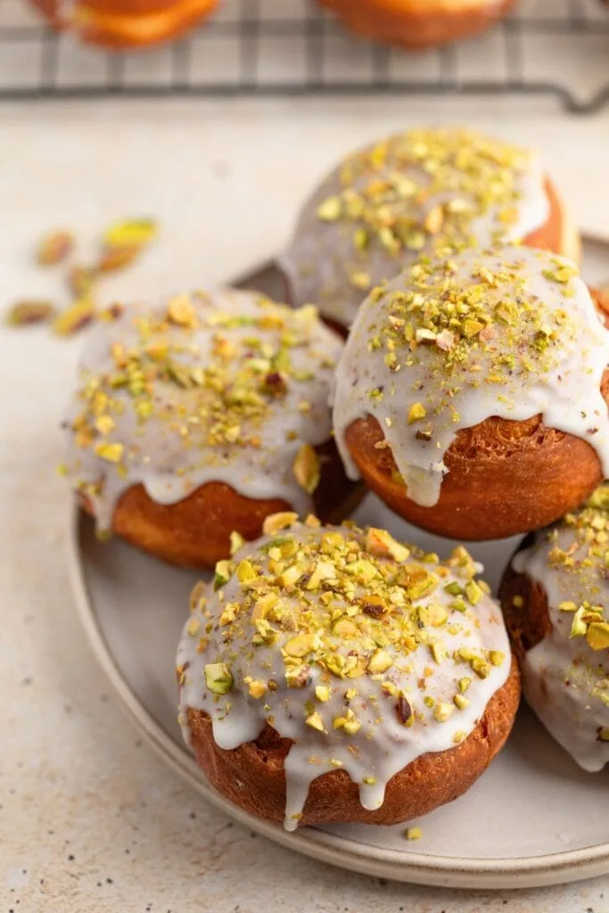 Glazed polish donuts with pistachio cream filling