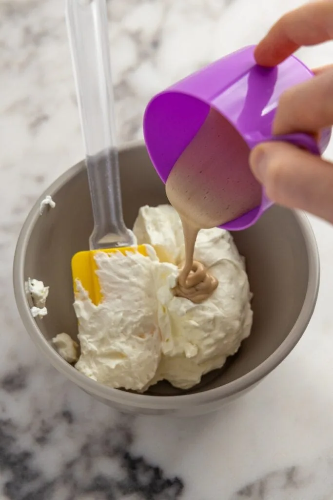 Adding cooked yolk mixture