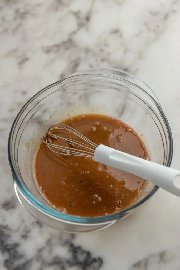 Whisking yolks, marsala, and sugar