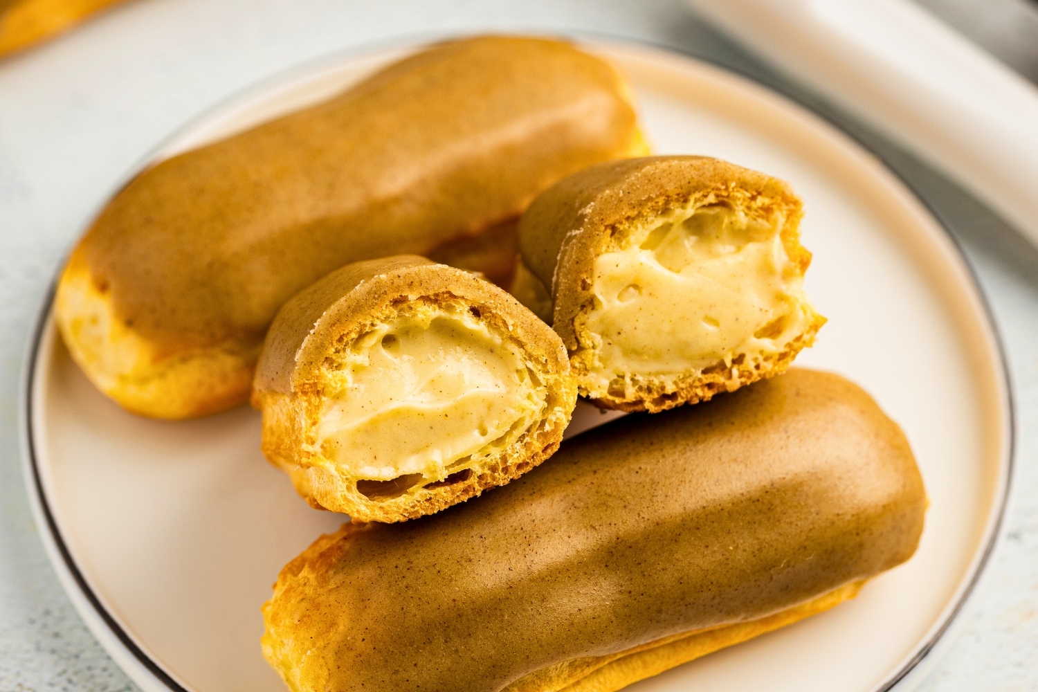 Ginger eclairs topped with delicious cinnamon glaze featured