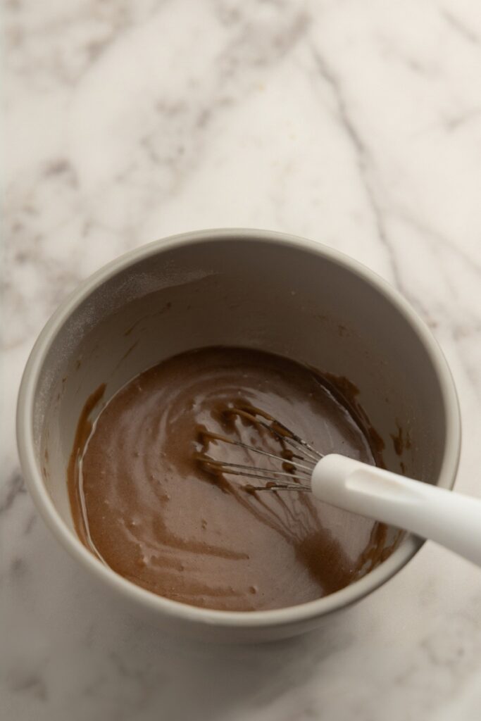 Stirring in the melted butter