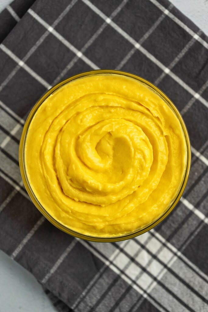 Homemade mango pastry cream in a glass bowl