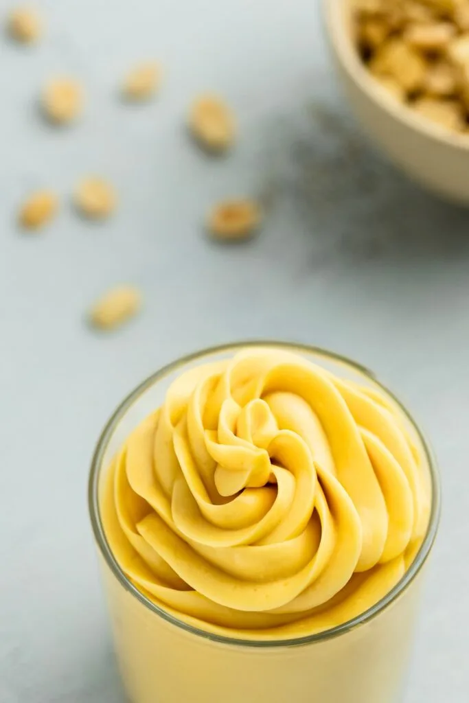 Sweet peanut butter pastry cream neatly swirled in a dessert glass