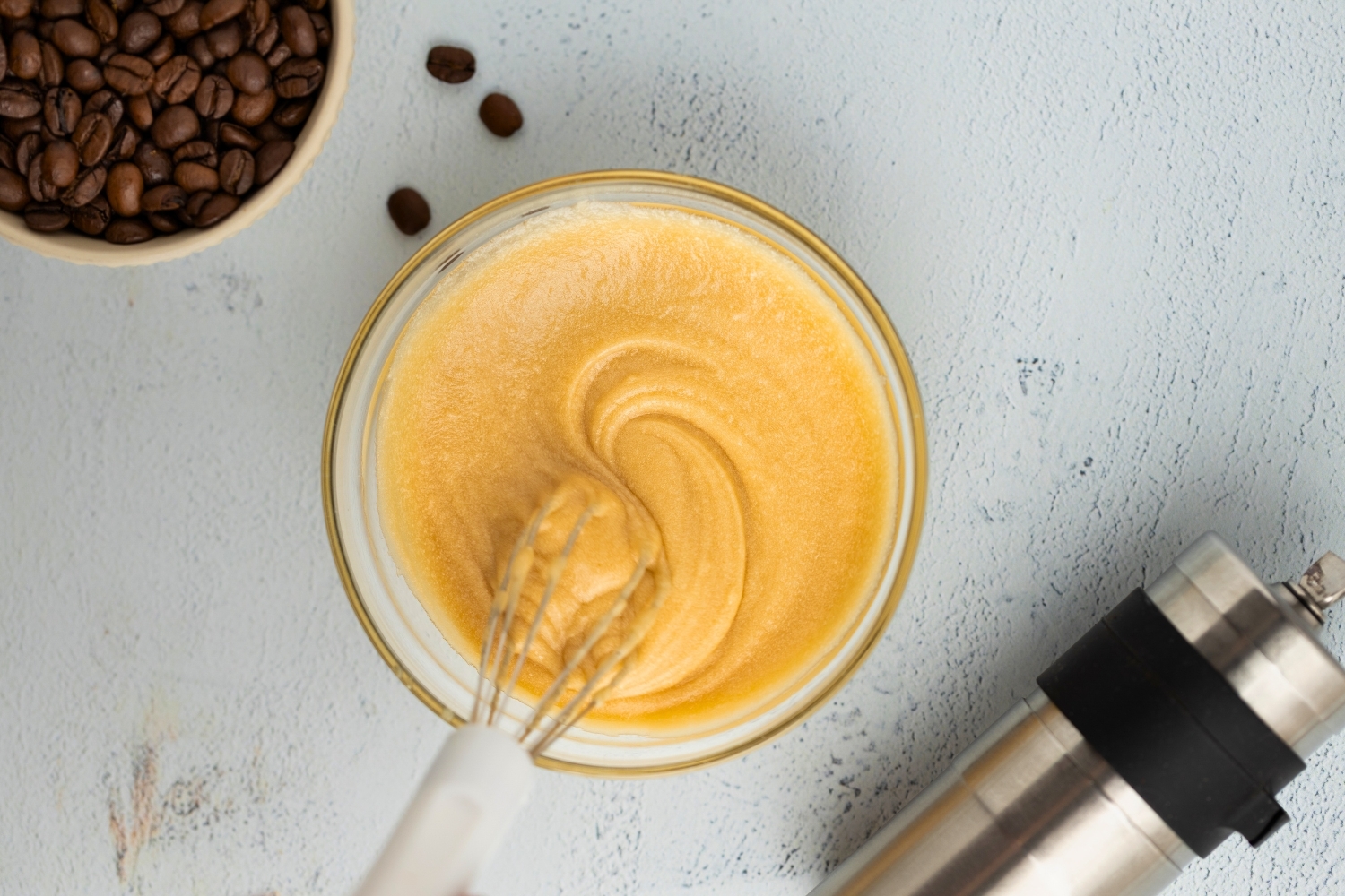 A bowl of freshly whisked coffee icing
