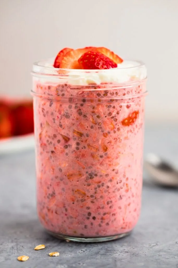 Breakfast ready strawberry overnight oats in a jar