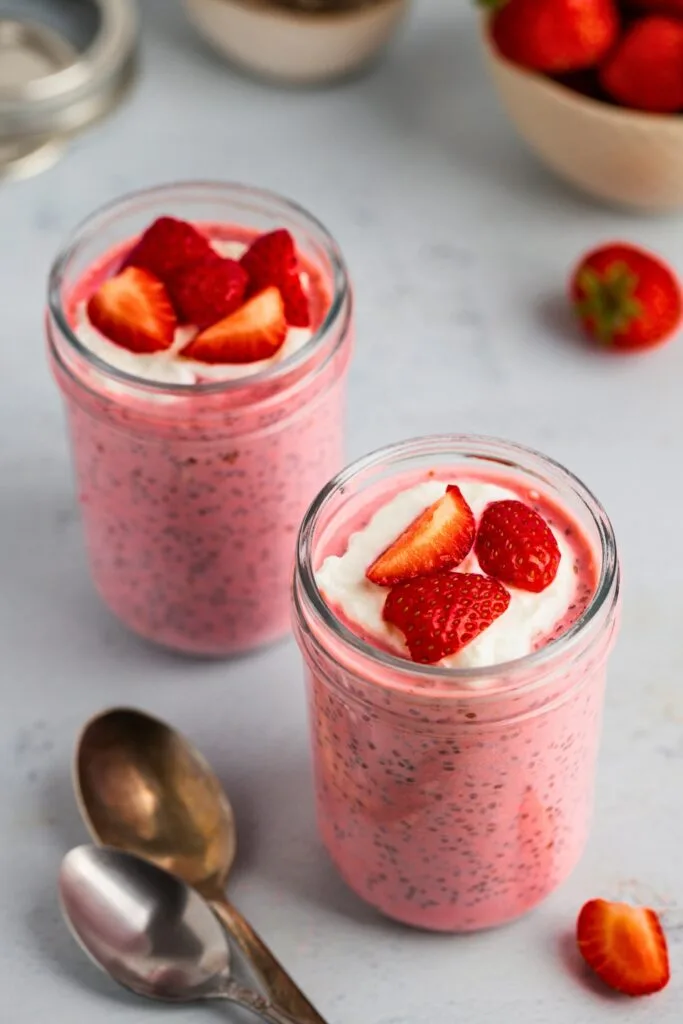 Fruity strawberry chia pudding topped with yogurt and fresh strawberries