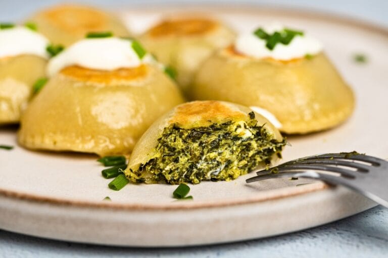 Spinach pierogi deliciously served on plate