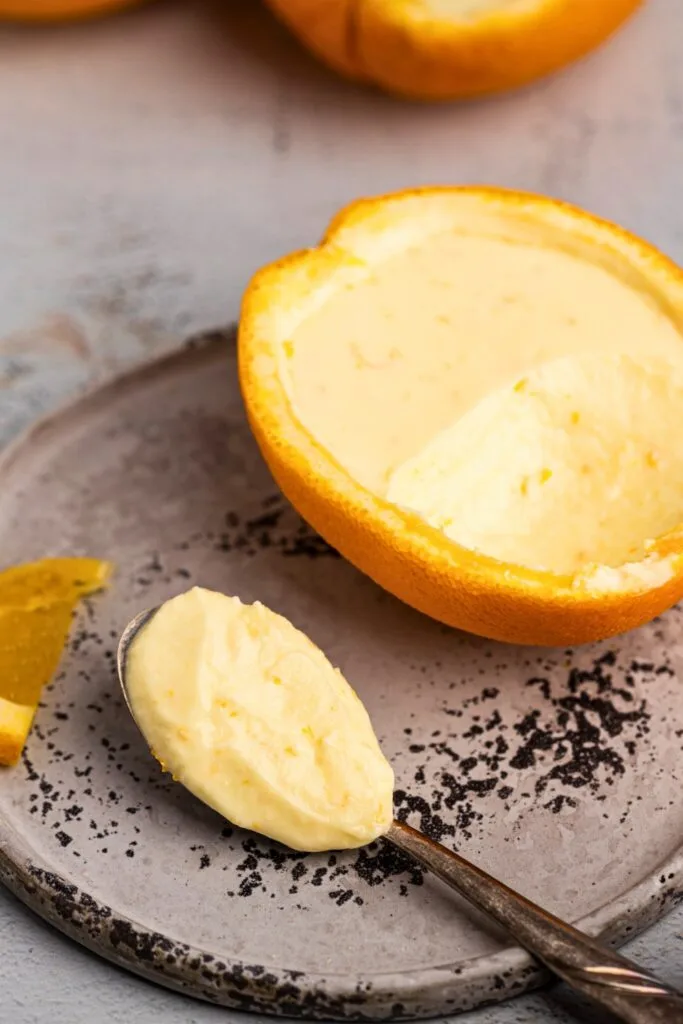 Fresh orange posset with a spoonful