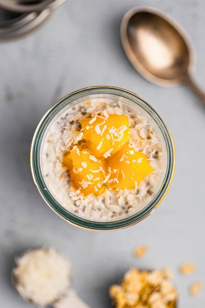 Homemade coconut overnight oats topped with peaches