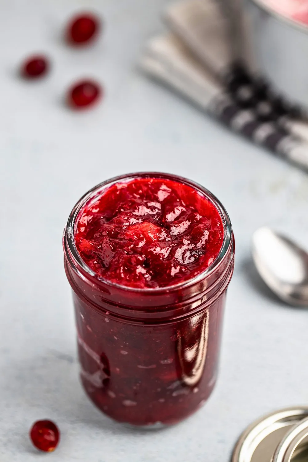 Cranberry compote in a glass jar