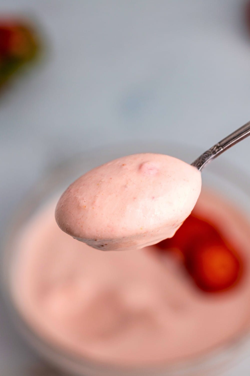 Strawberry yogurt bowl spoon closeup