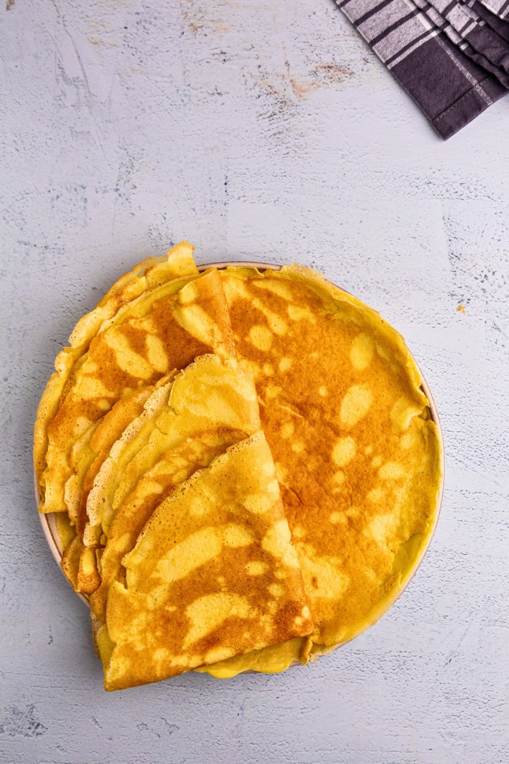 Cottage cheese crepes folded into quarters