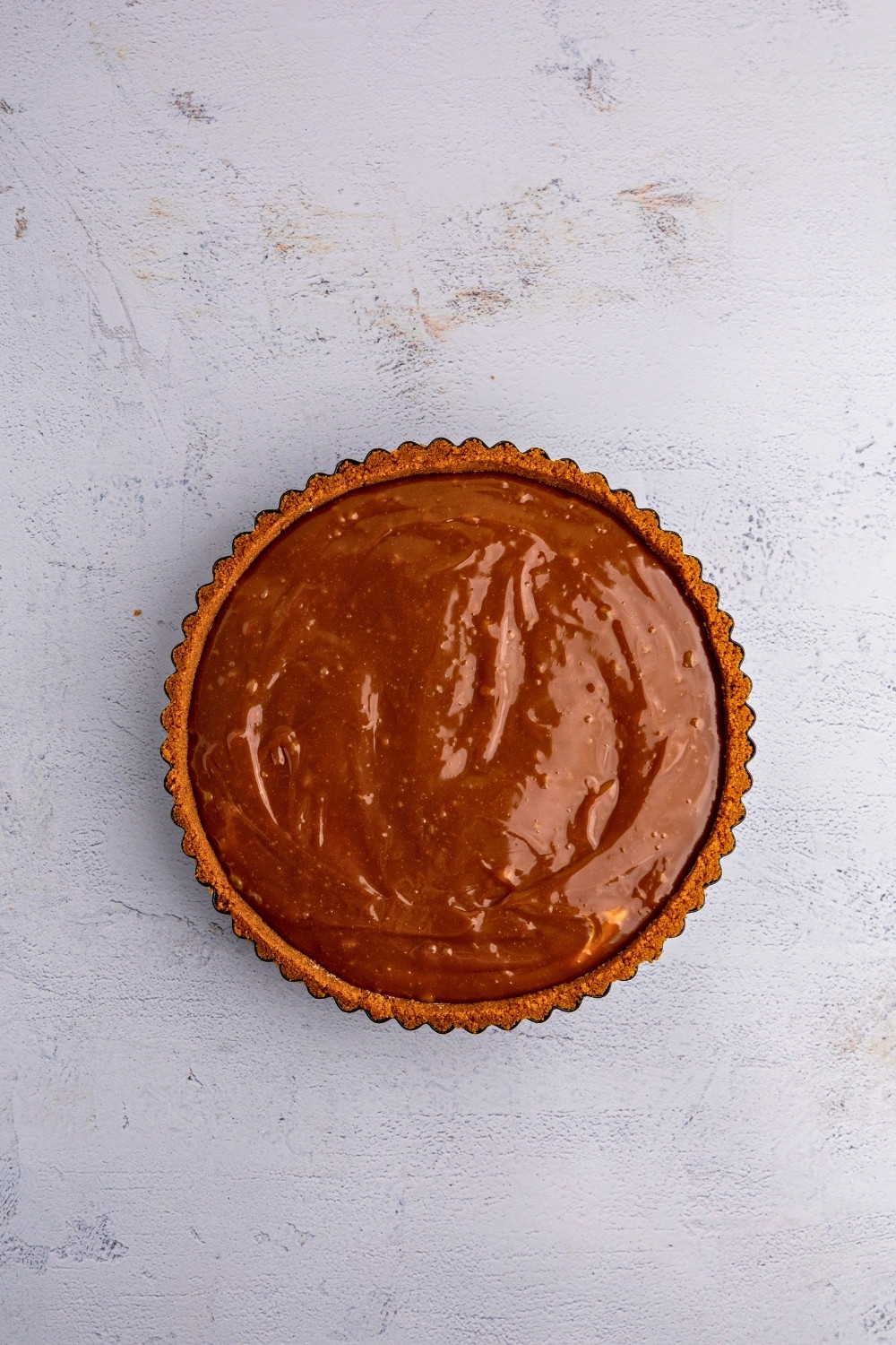 No Bake Biscoff Tart after pouring glaze