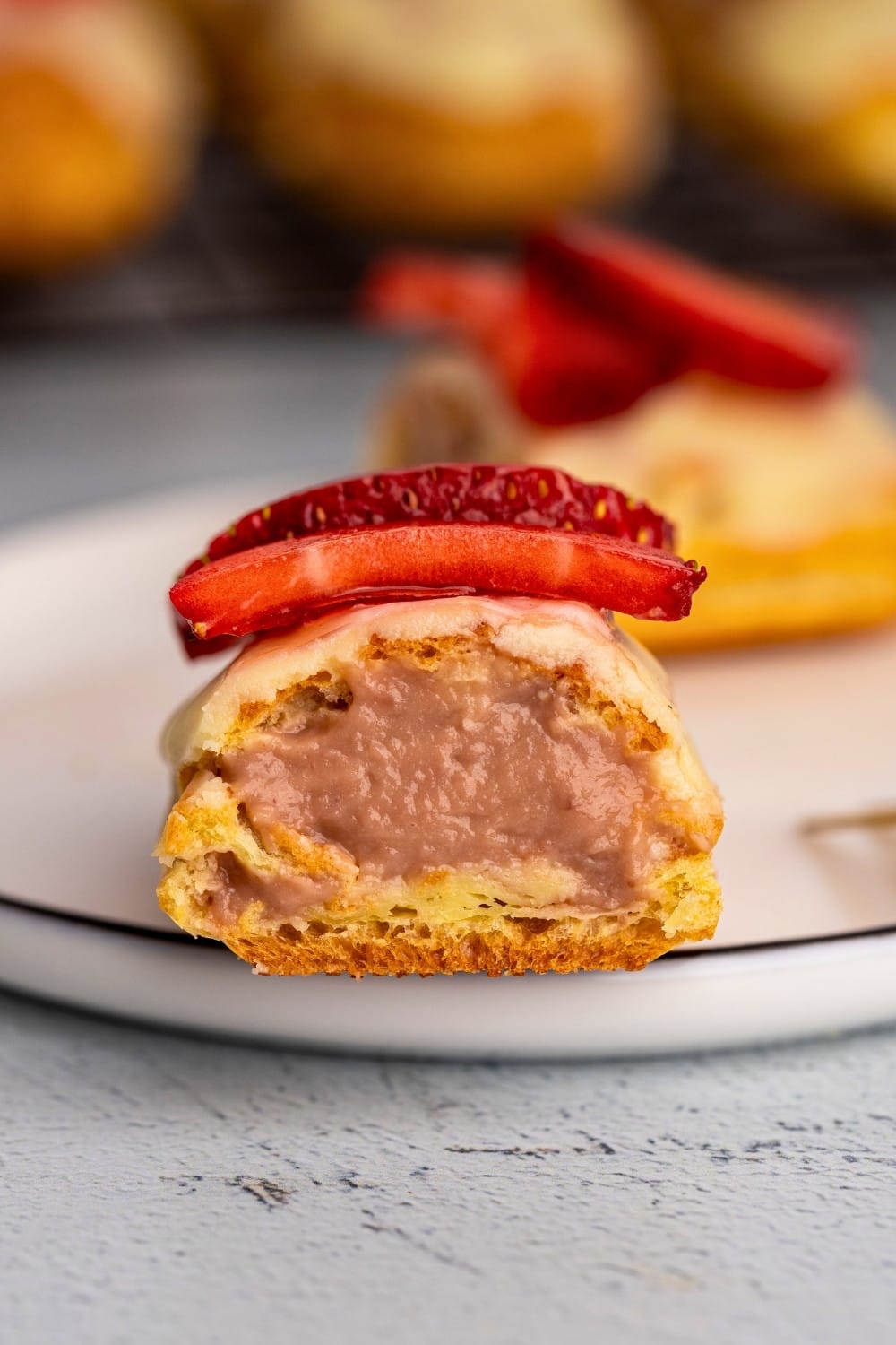 Strawberry eclair cut in half