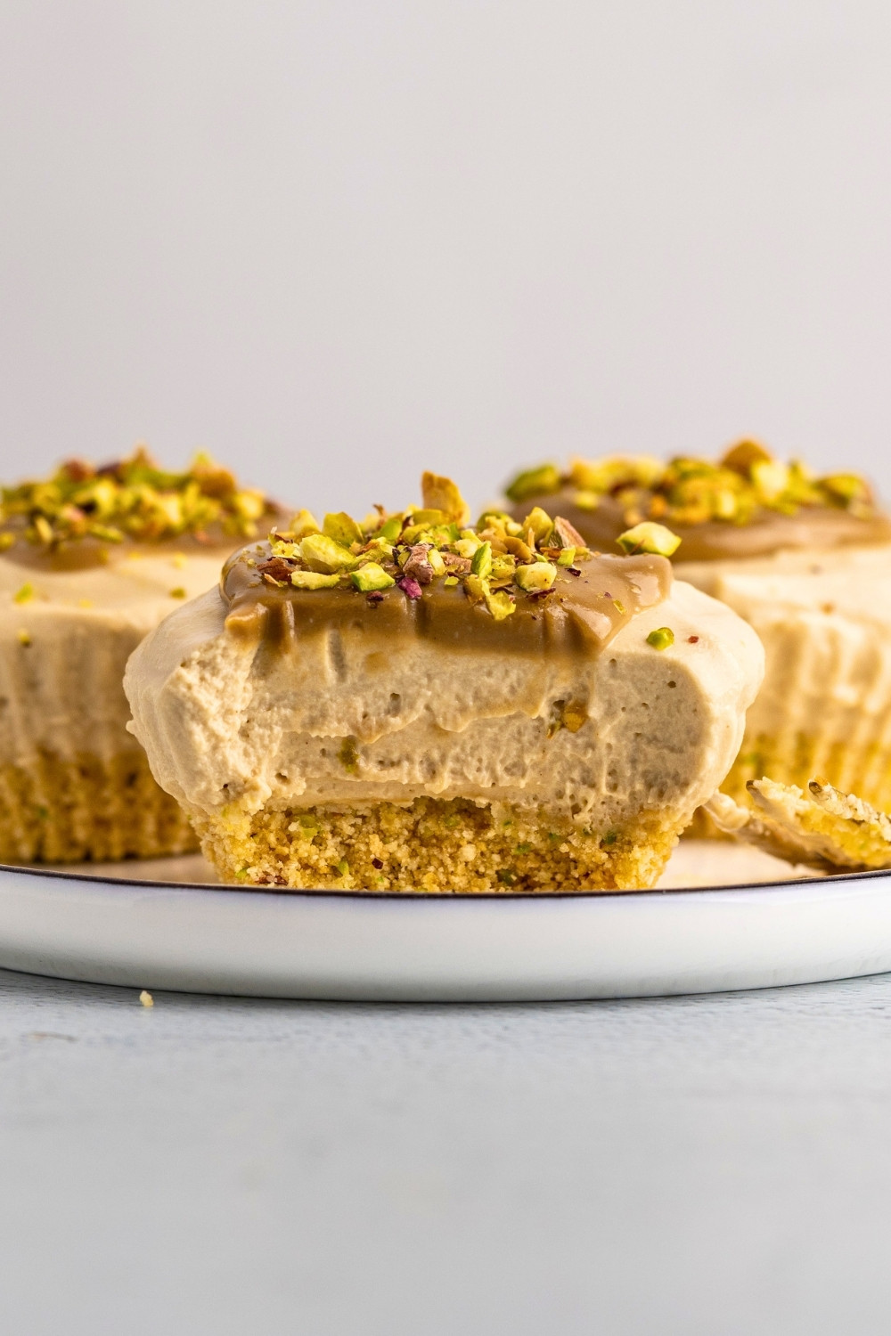 Mini pistachio cheesecakes cut in half