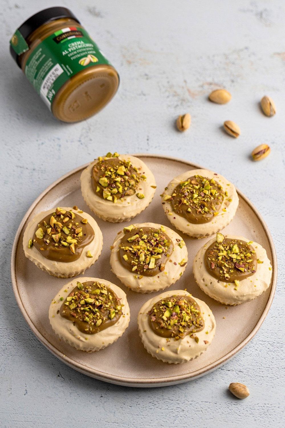 Mini pistachio cheesecakes plated