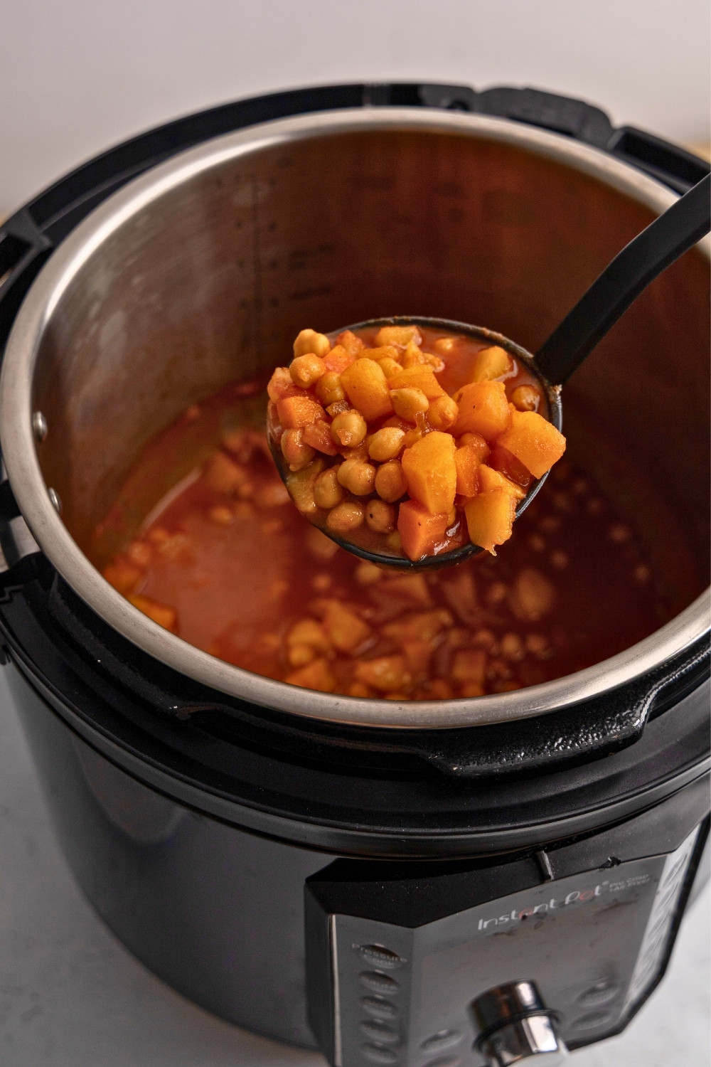 Instant pot chickpea tomato soup on a ladle