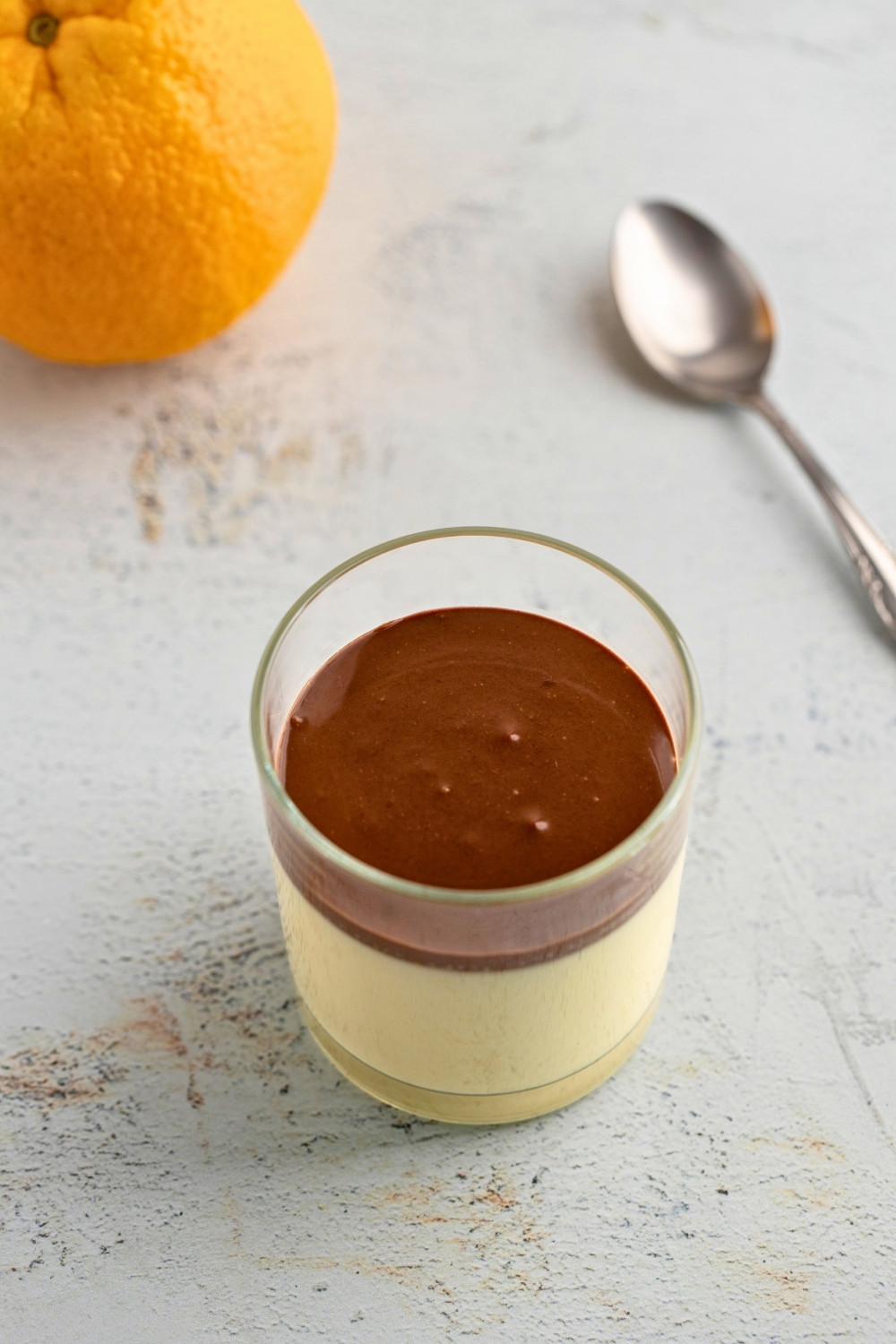 Orange panna cotta served in glass jar