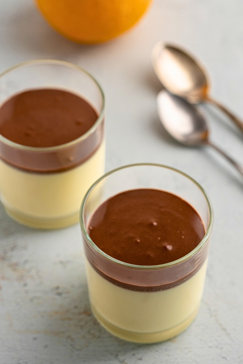 Orange panna cotta served in two glasses