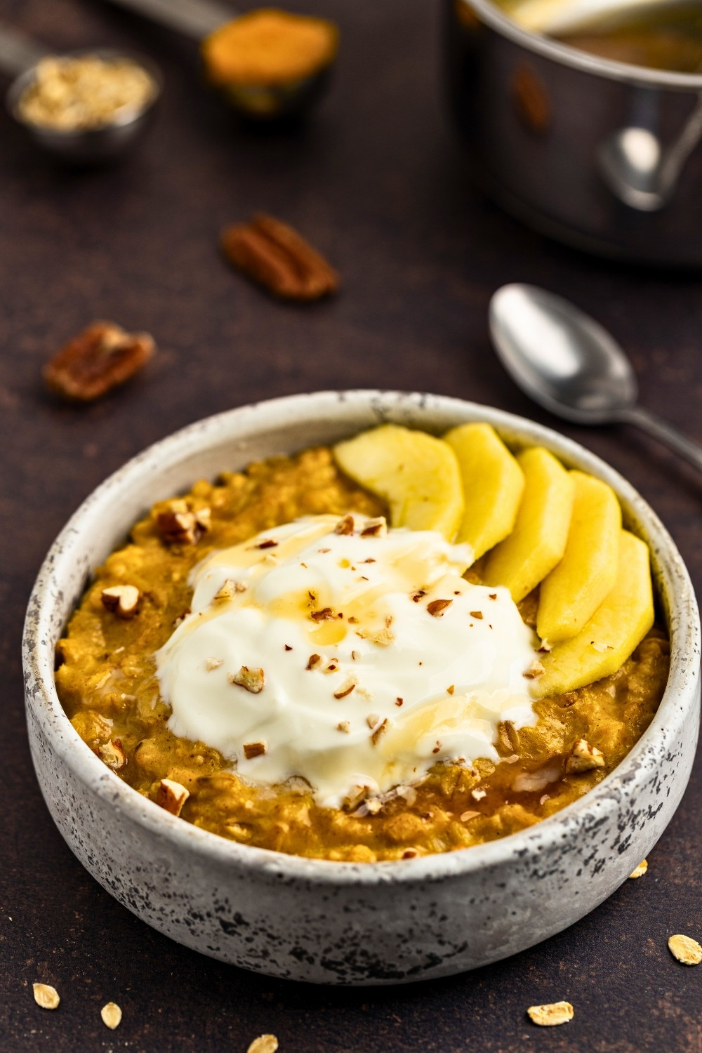 Pumpkin oatmeal served with yogurt and apples