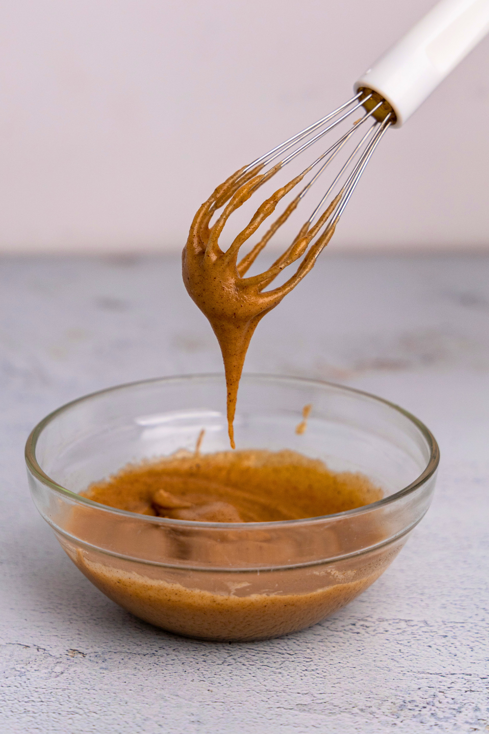 Pumpkin spice glaze on a whisk