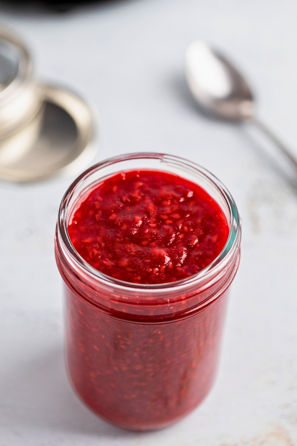 Raspberry compote in glass jar