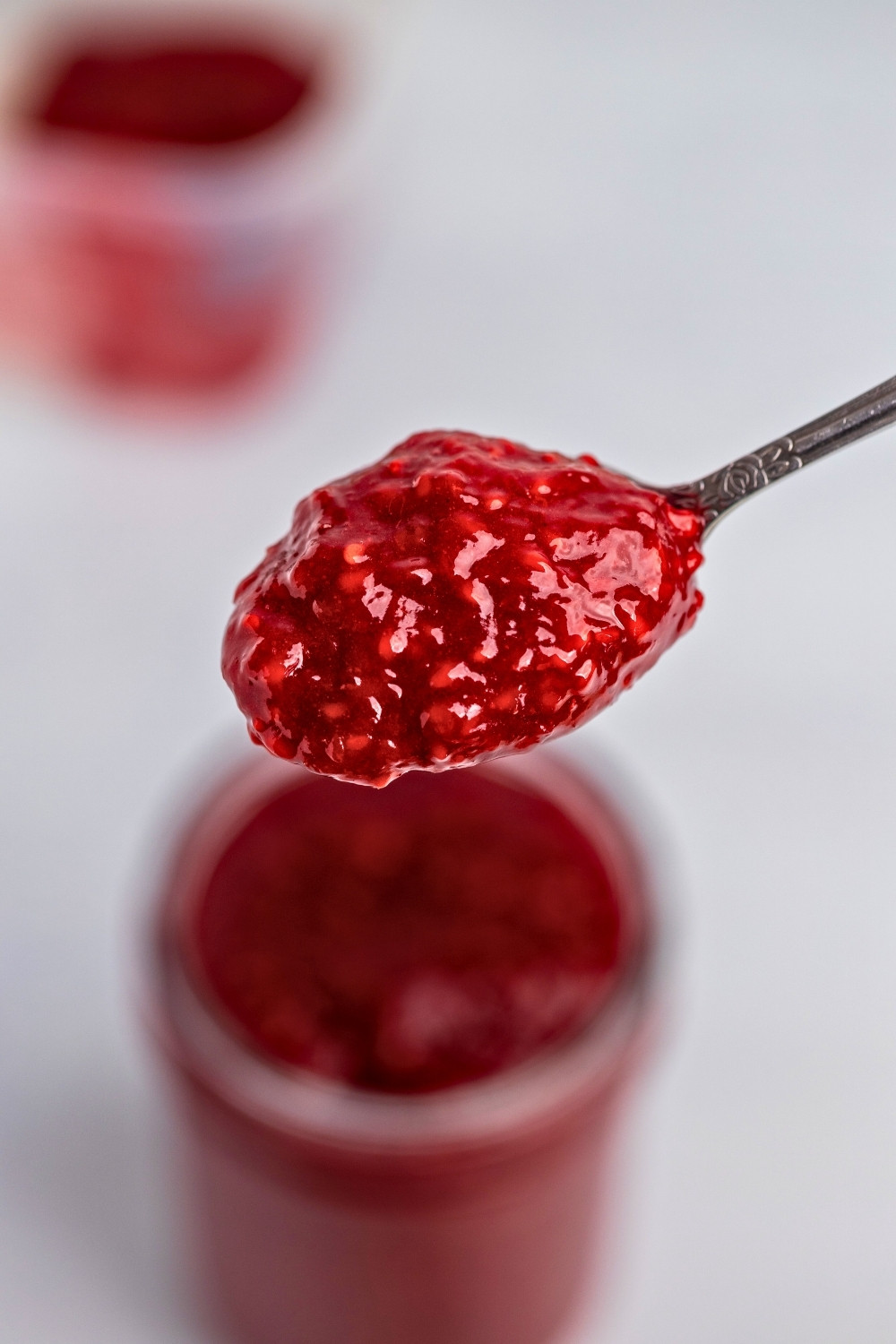 Raspberry compote spoon closeup