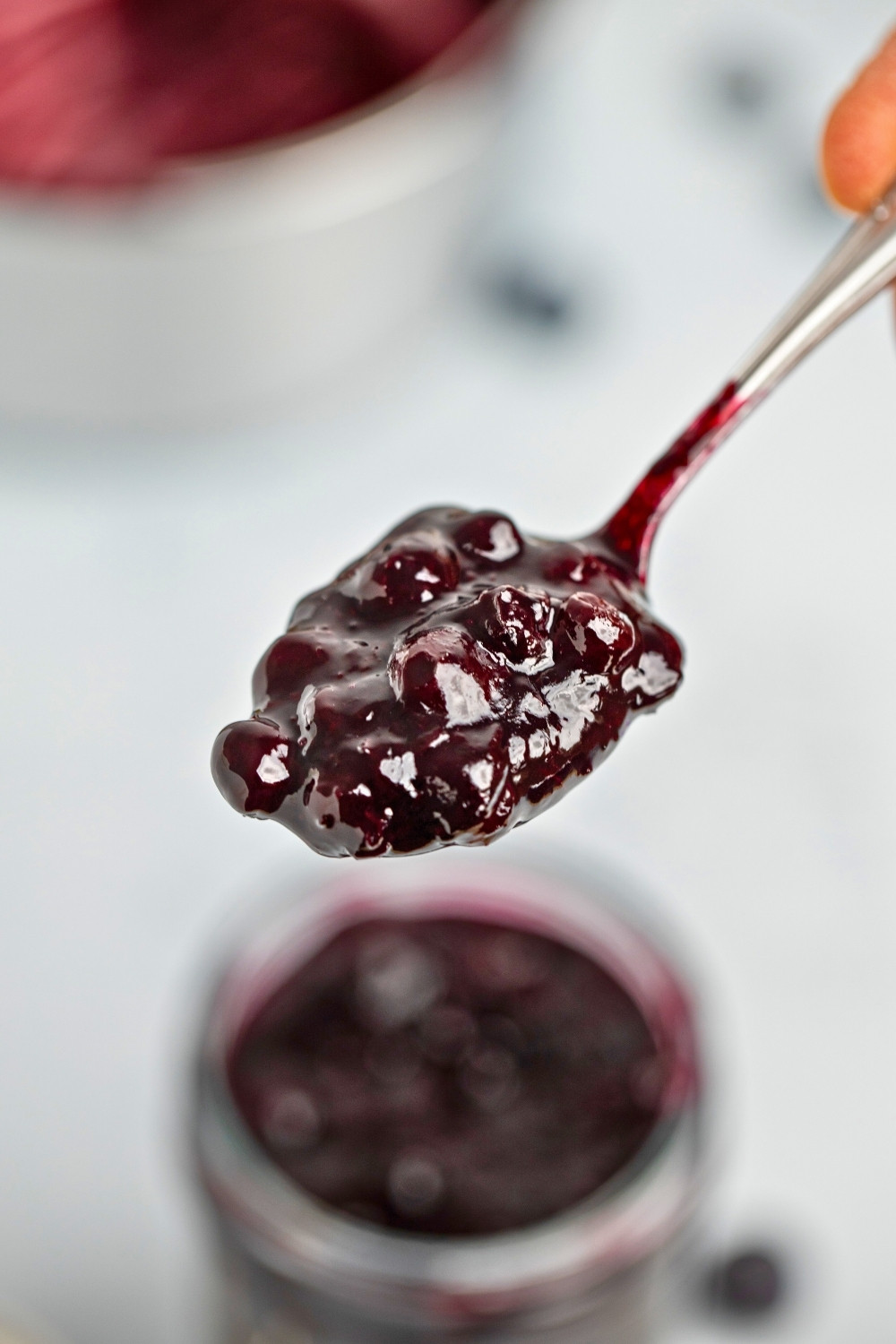 Spooning blueberry compote